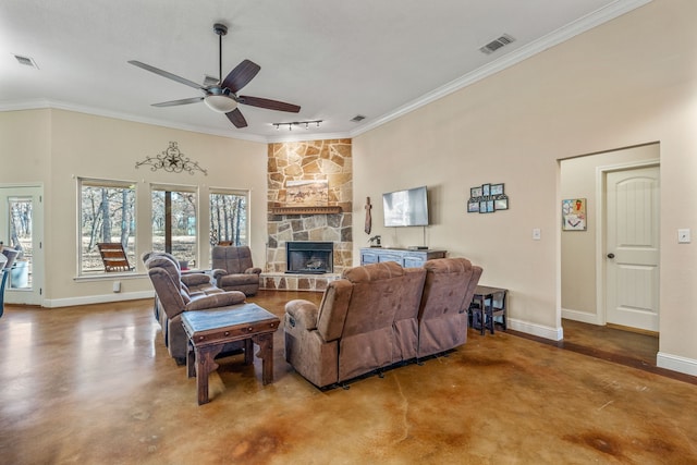 living room featuring ceiling fan, ornamental molding, track lighting, and concrete floors