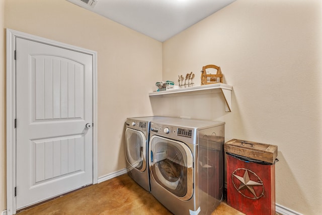 washroom featuring separate washer and dryer and light carpet