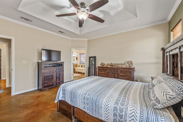 bedroom with connected bathroom, a tray ceiling, ceiling fan, and crown molding