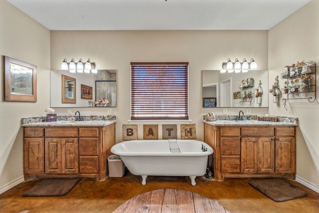 bathroom with vanity and a tub