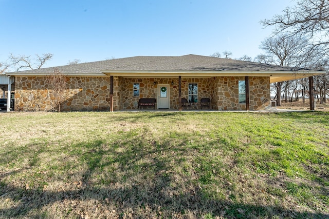 back of house with a lawn