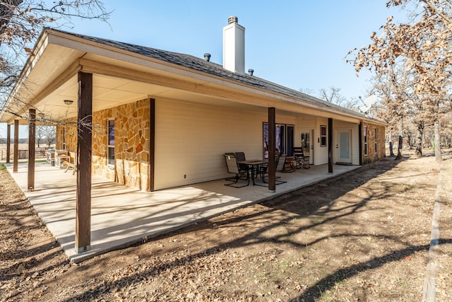 rear view of house featuring a patio