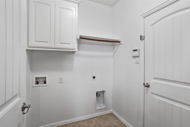 clothes washing area featuring hookup for an electric dryer, cabinets, and hookup for a washing machine