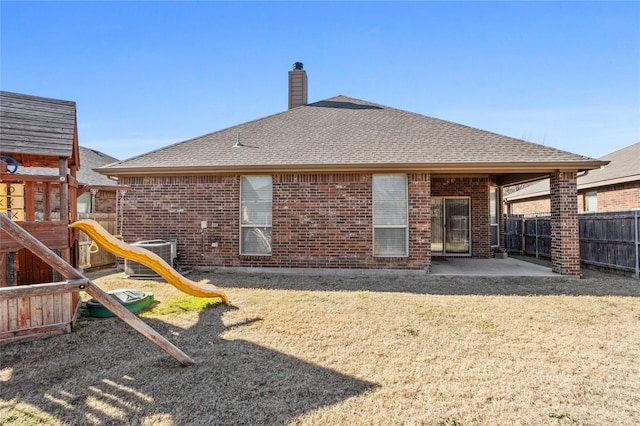 back of property featuring a playground, a patio area, and central AC unit