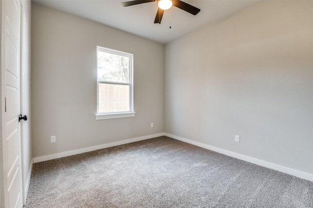 spare room with carpet and ceiling fan