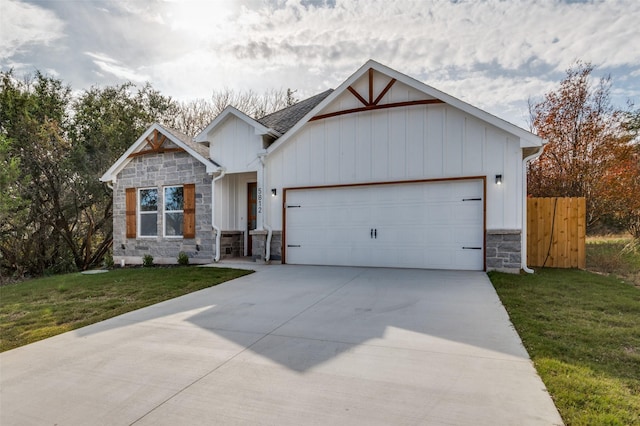 view of front of house with a front yard and a garage