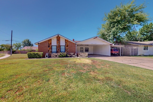 ranch-style home with a front yard and a carport