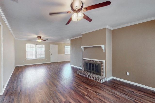 unfurnished living room with crown molding, a fireplace, ceiling fan, and dark wood-type flooring