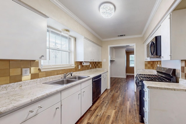 kitchen featuring white cabinets, range with gas cooktop, tasteful backsplash, and dishwasher