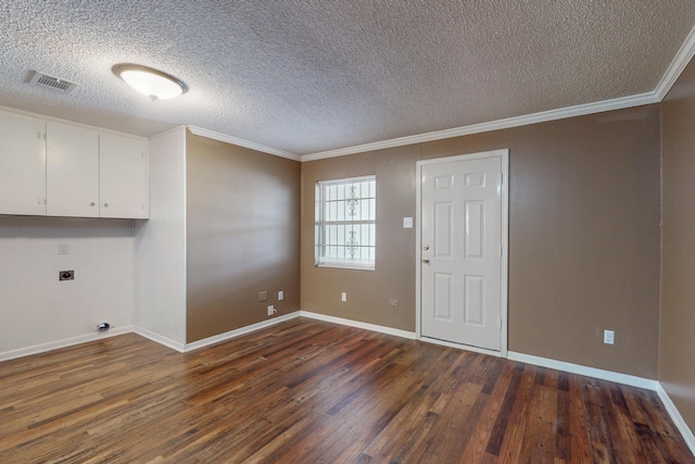 interior space featuring hookup for an electric dryer, crown molding, cabinets, and dark wood-type flooring