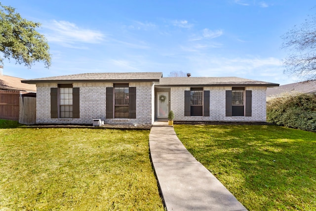 ranch-style house with a front lawn