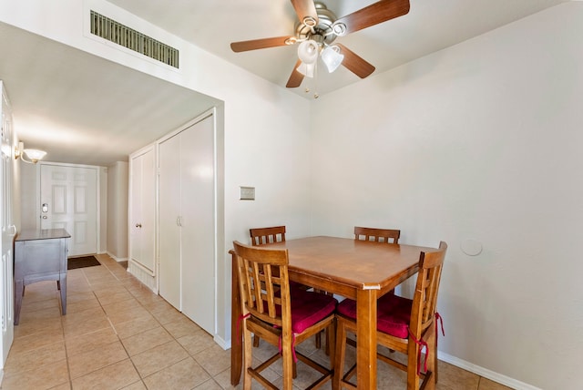 dining room featuring ceiling fan and light tile patterned flooring