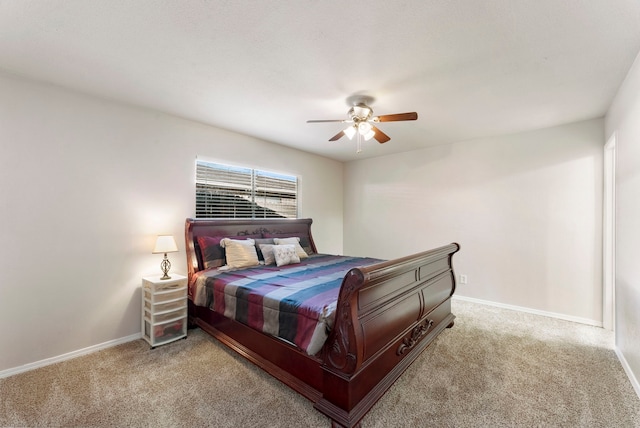 bedroom featuring ceiling fan and light carpet