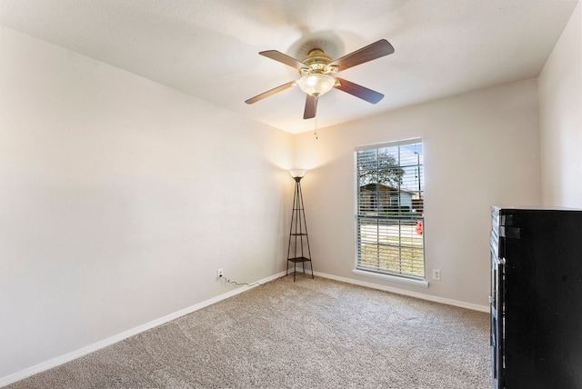 unfurnished room featuring carpet flooring and ceiling fan