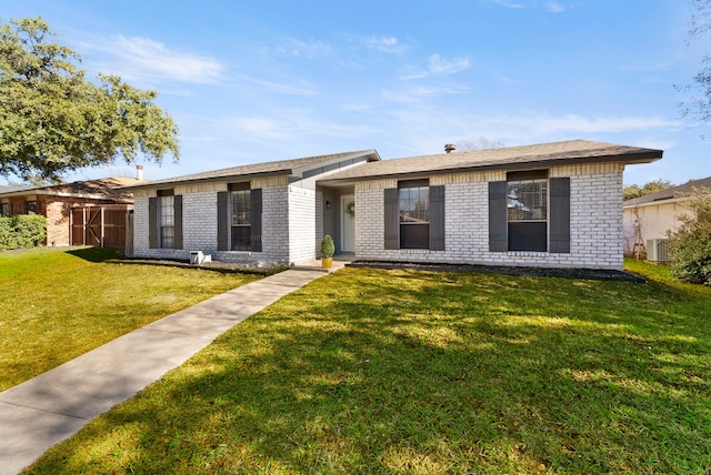 ranch-style house featuring a front yard and central AC