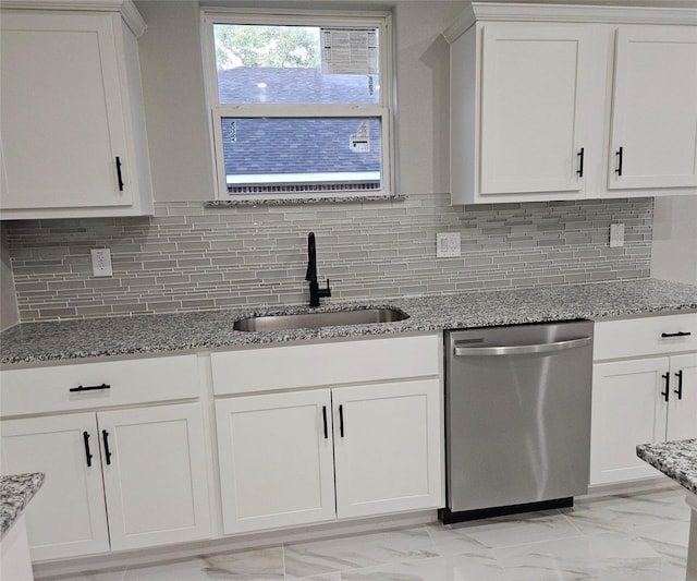 kitchen featuring white cabinetry, dishwasher, light stone counters, and sink