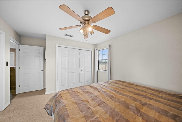 bedroom featuring carpet, ceiling fan, and a closet