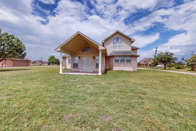 view of front of home featuring french doors and a front lawn