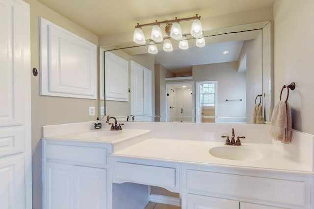 bathroom featuring vanity and an enclosed shower