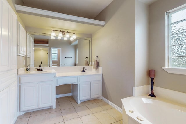 bathroom with vanity, tile patterned floors, and a bathtub