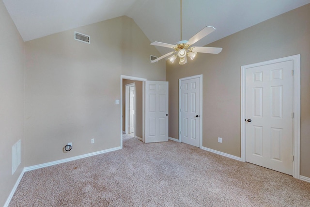 unfurnished bedroom with light carpet, ceiling fan, and lofted ceiling