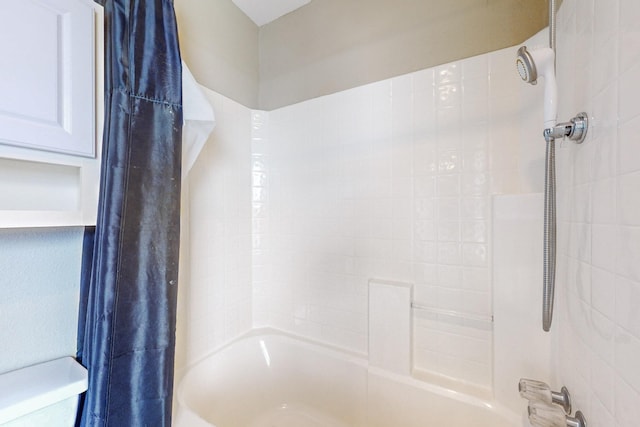 bathroom with toilet and shower / bathtub combination with curtain