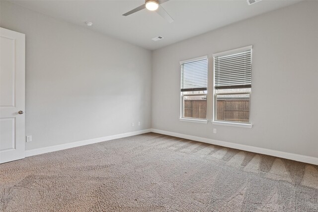 unfurnished room featuring carpet floors and ceiling fan