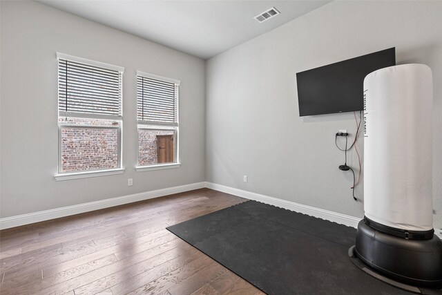 workout area featuring dark hardwood / wood-style floors