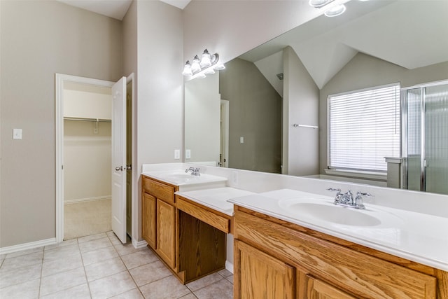 bathroom featuring tile patterned floors, vanity, and walk in shower