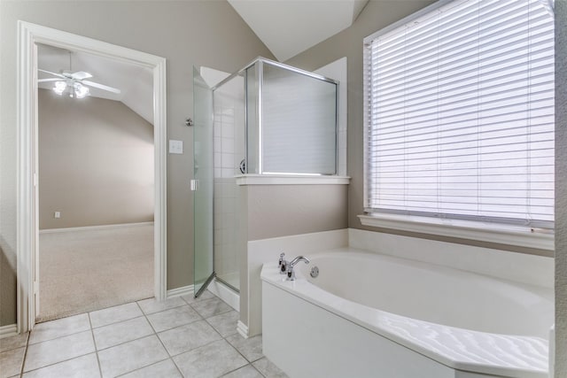 bathroom with ceiling fan, tile patterned flooring, a healthy amount of sunlight, and lofted ceiling