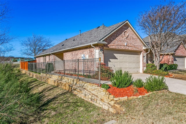 exterior space with a garage and a front yard