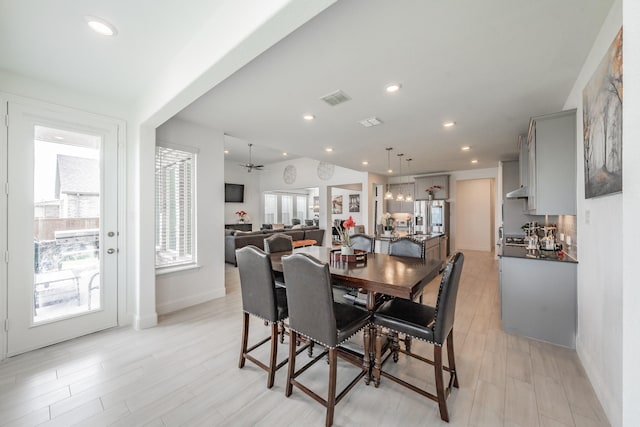 dining area featuring ceiling fan and light hardwood / wood-style floors