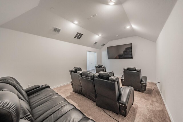 carpeted cinema with vaulted ceiling