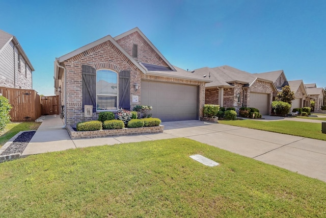 view of front of property with a garage and a front yard