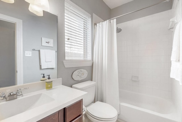 full bathroom featuring vanity, toilet, and shower / bath combo with shower curtain