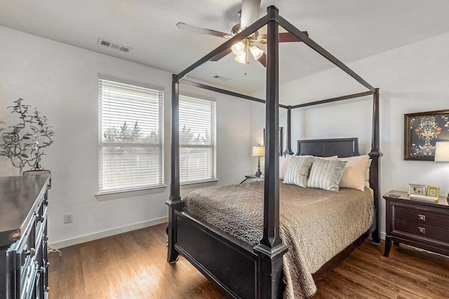 bedroom with ceiling fan and dark hardwood / wood-style flooring