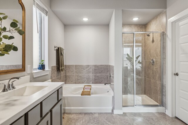 bathroom featuring tile patterned flooring and vanity