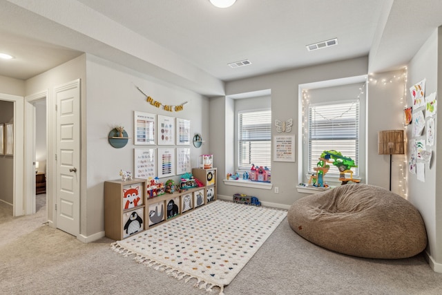 rec room with light colored carpet