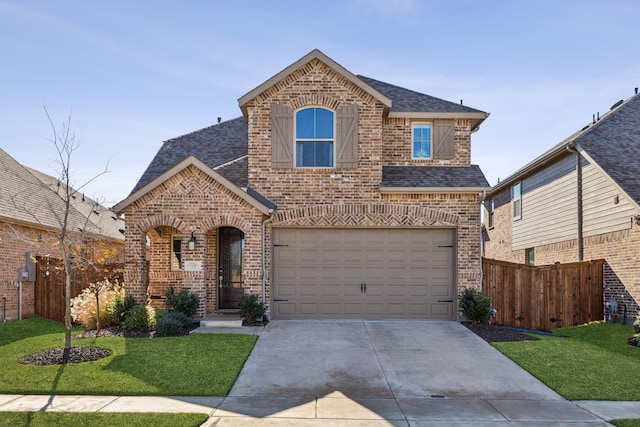 view of front of house with a garage and a front yard