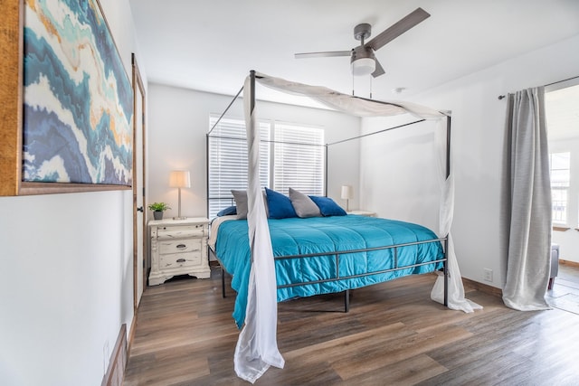 bedroom featuring ceiling fan and dark wood-type flooring