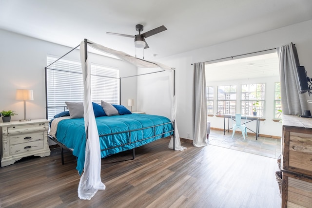 bedroom with hardwood / wood-style flooring and ceiling fan