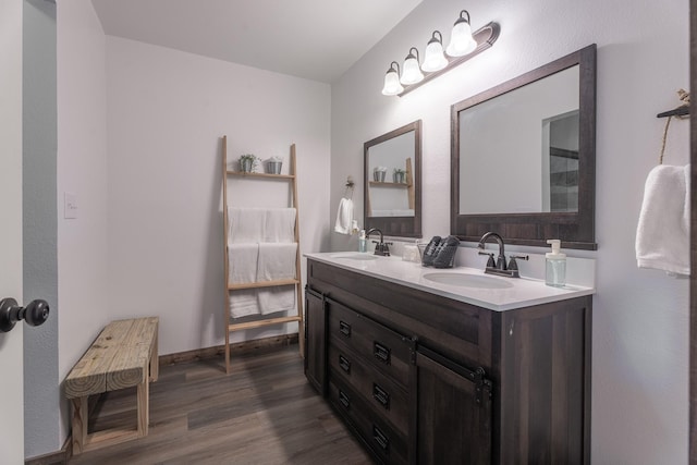 bathroom featuring hardwood / wood-style floors and vanity