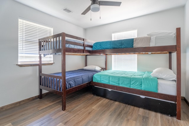 bedroom featuring hardwood / wood-style floors and ceiling fan