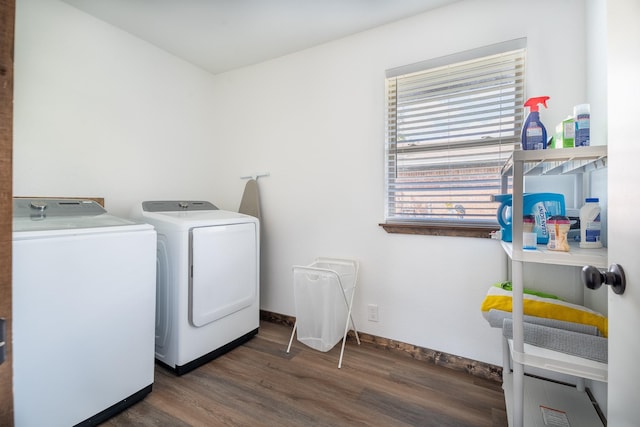 laundry room with dark hardwood / wood-style floors and separate washer and dryer