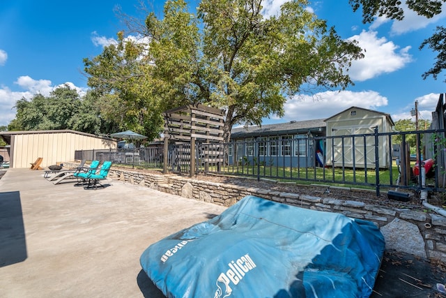 view of patio / terrace featuring a storage unit