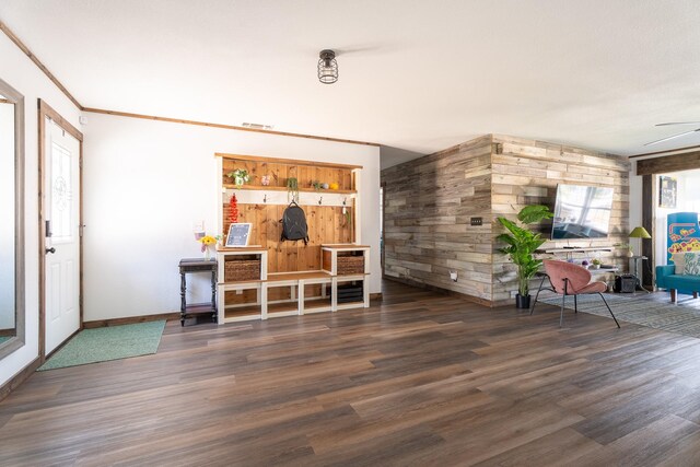 living room with ceiling fan and dark wood-type flooring