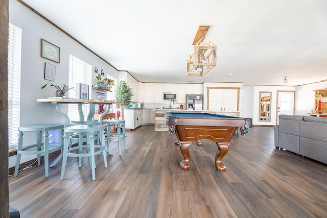 rec room with hardwood / wood-style floors, sink, ornamental molding, and pool table