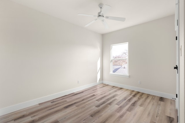 spare room featuring ceiling fan and light hardwood / wood-style flooring