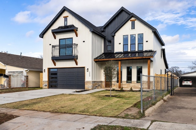 modern farmhouse featuring a garage, a balcony, and a front yard