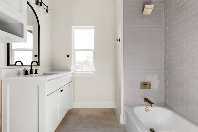 bathroom featuring vanity, tile patterned floors, and tiled shower / bath